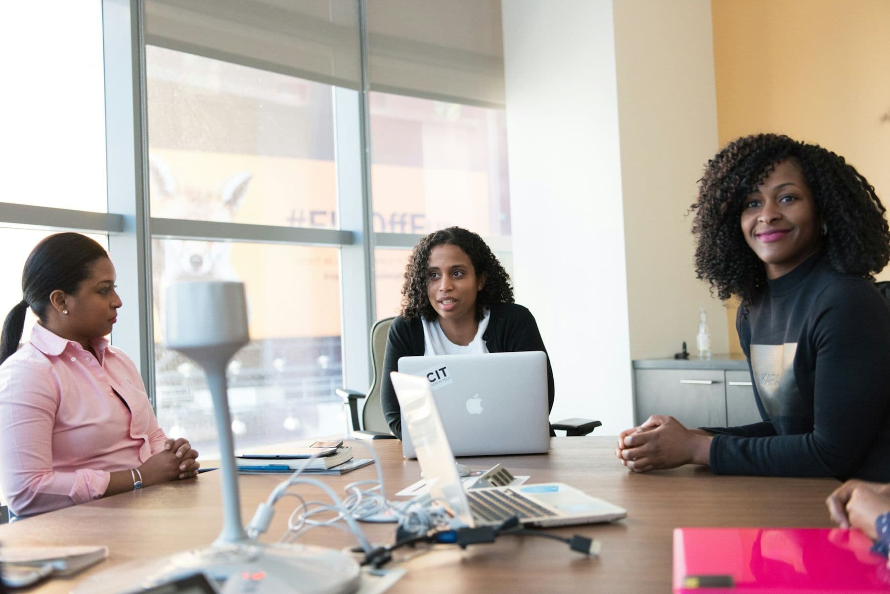 Lawyers meeting around a table in a bright office